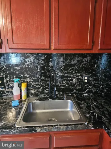 a kitchen with an oven and cabinets