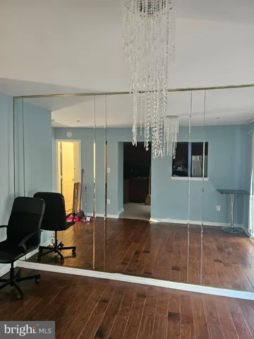 an empty room with closet area