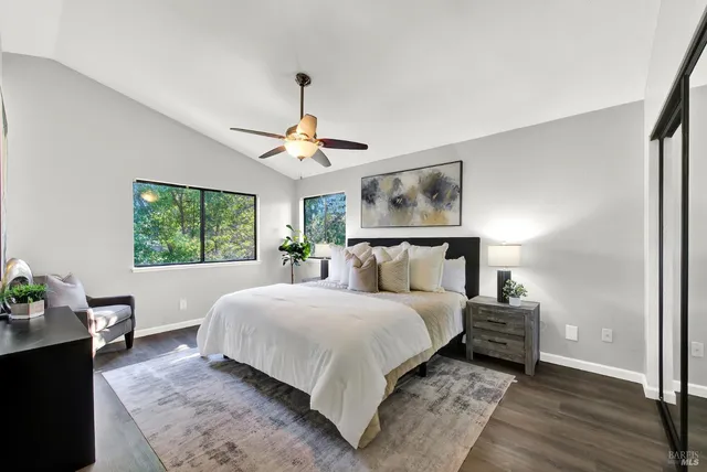 a bedroom with a large bed and a window