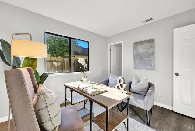 a view of a dining room with furniture window and wooden floor