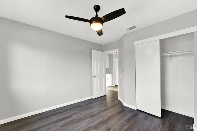 a view of an empty room and wooden floor