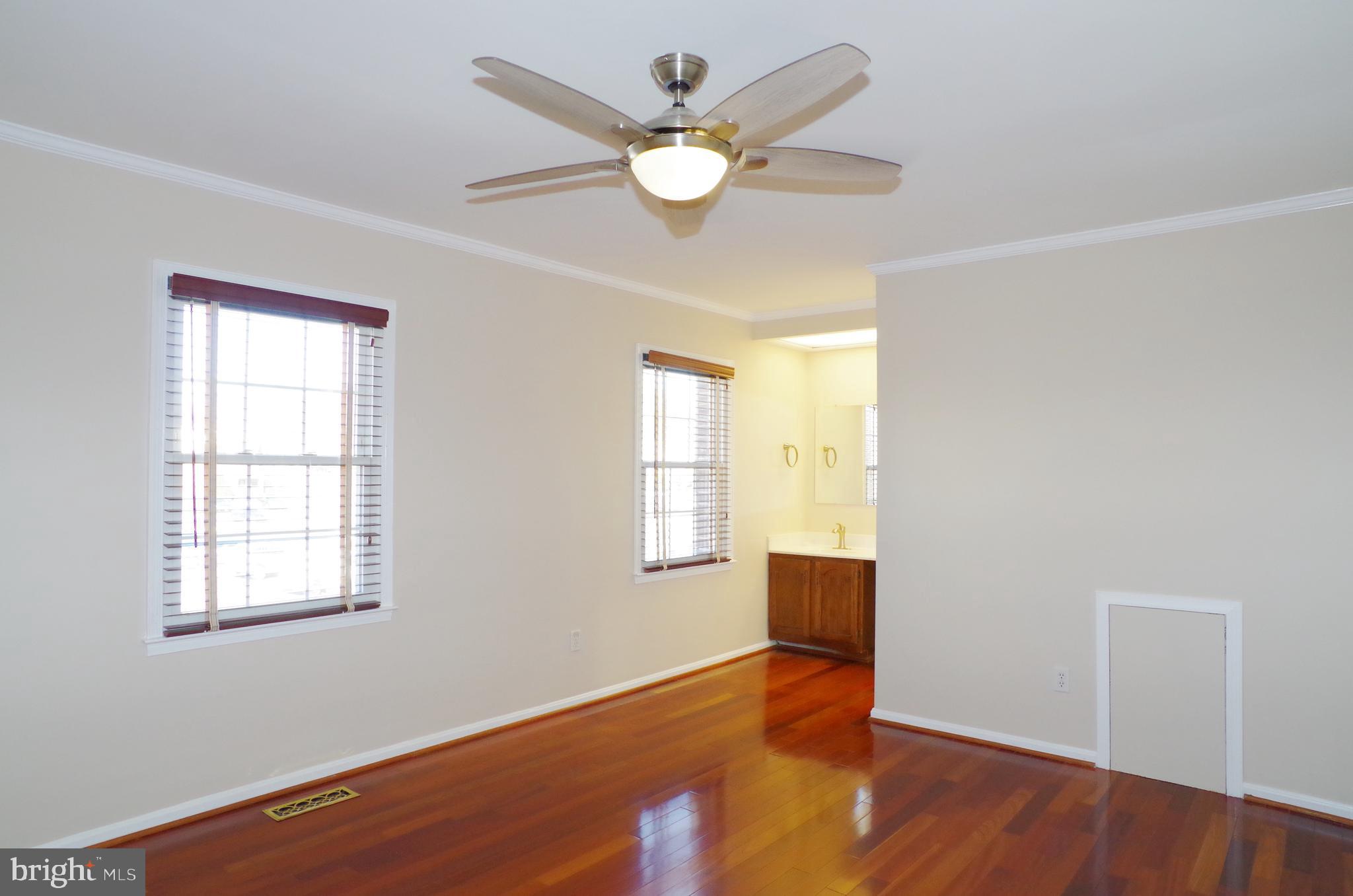 4492 Ruggles Court Annandale, VA 22003 - Photo 11 of 17 an empty room with wooden floor and windows