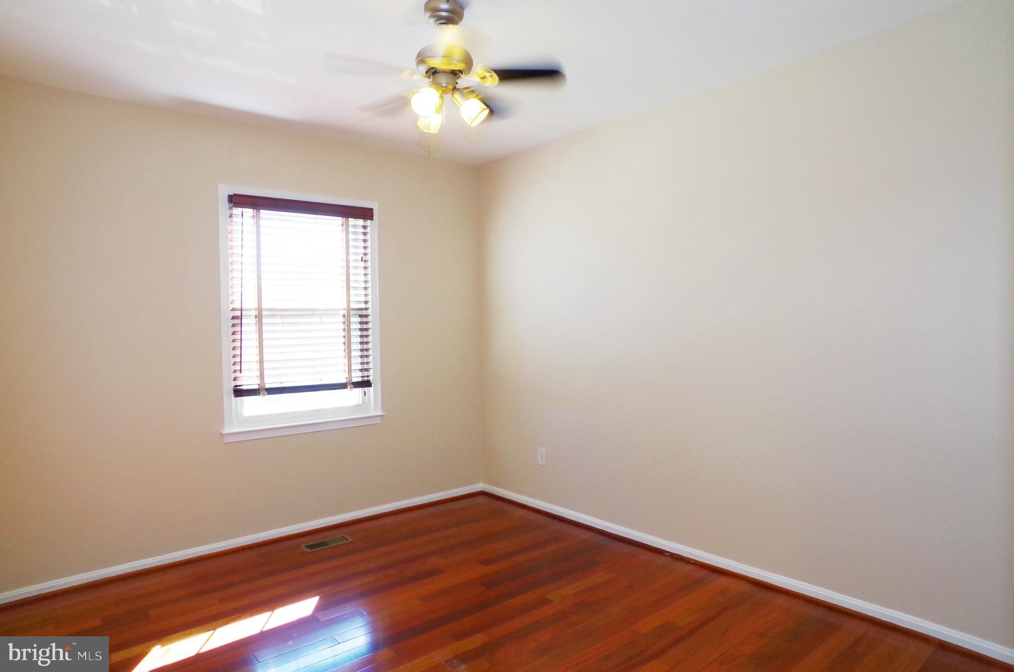 4492 Ruggles Court Annandale, VA 22003 - Photo 13 of 17 an empty room with a window and a ceiling fan