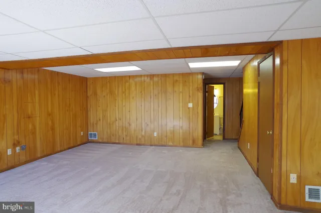a view of entryway with wooden walls