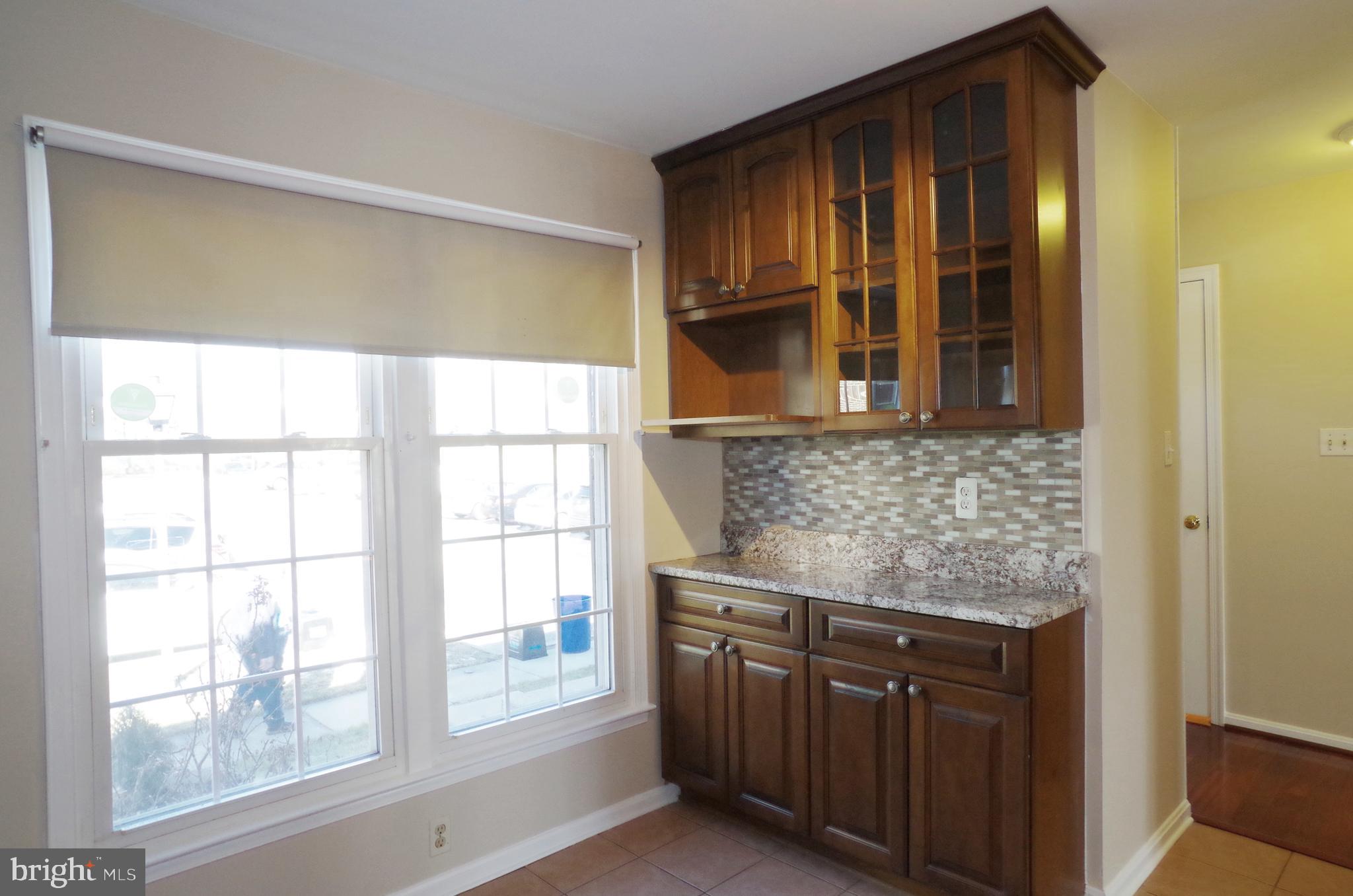 4492 Ruggles Court Annandale, VA 22003 - Photo 10 of 17 a kitchen with stainless steel appliances granite countertop cabinets and window
