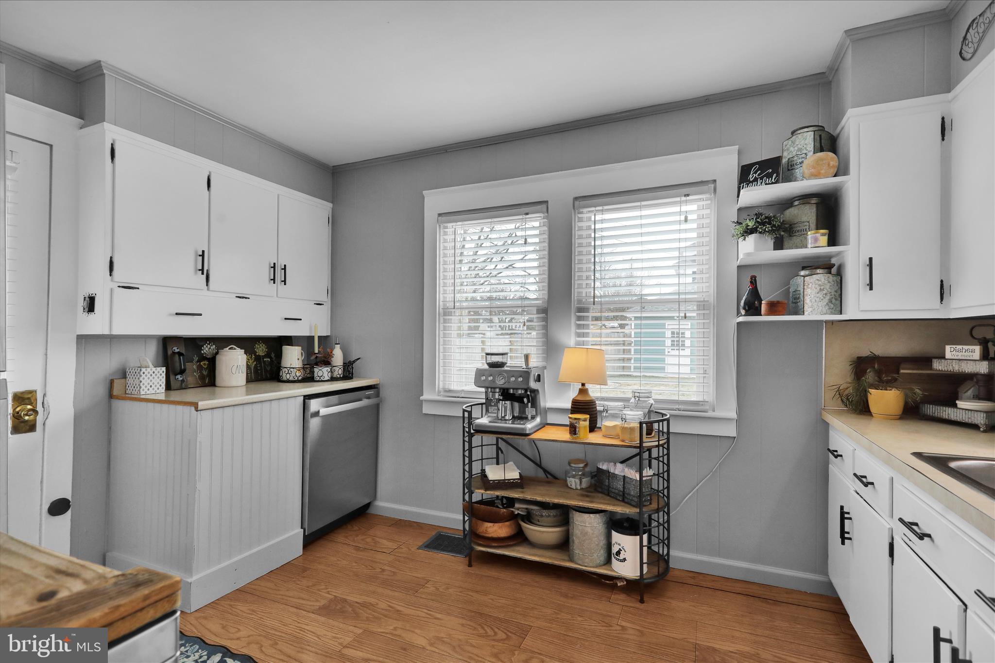 50 East 2nd Avenue Lititz, PA 17543 - Photo 15 of 35 a kitchen with stainless steel appliances white cabinets and wooden floors