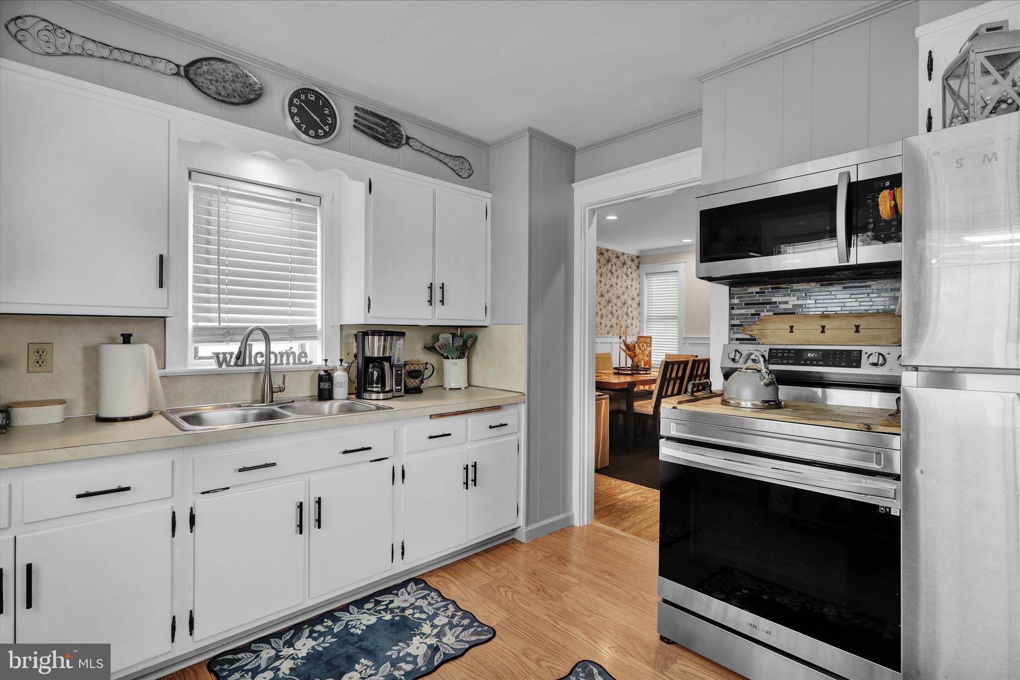 50 East 2nd Avenue Lititz, PA 17543 - Photo 16 of 35 a kitchen with stainless steel appliances granite countertop a stove a sink and a microwave