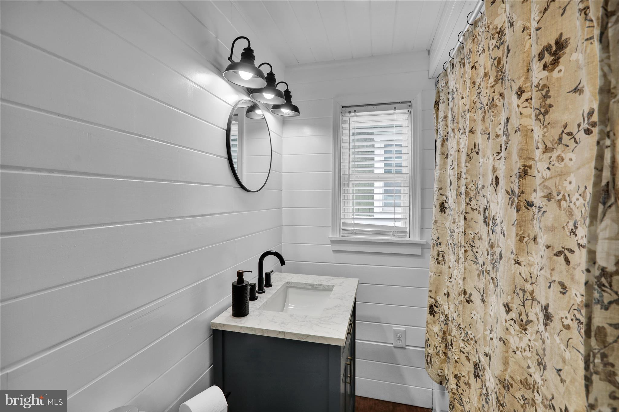 50 East 2nd Avenue Lititz, PA 17543 - Photo 25 of 35 a bathroom with a sink a vanity and a shower