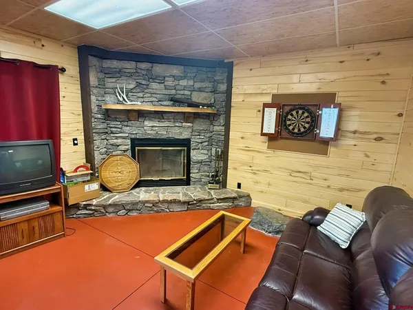 a backyard of a fireplace with furniture