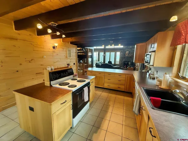 a kitchen with a stove and a sink