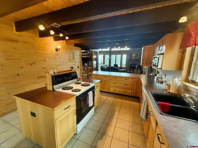a kitchen with a stove and a sink