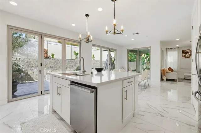 a kitchen with center island and windows
