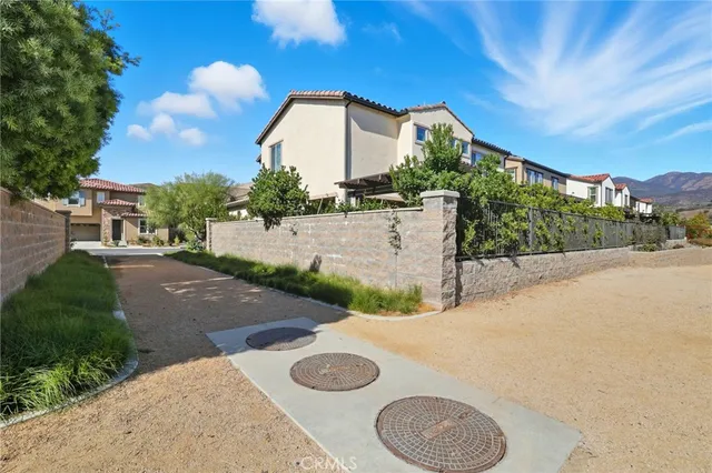 a view of a two chairs in the patio
