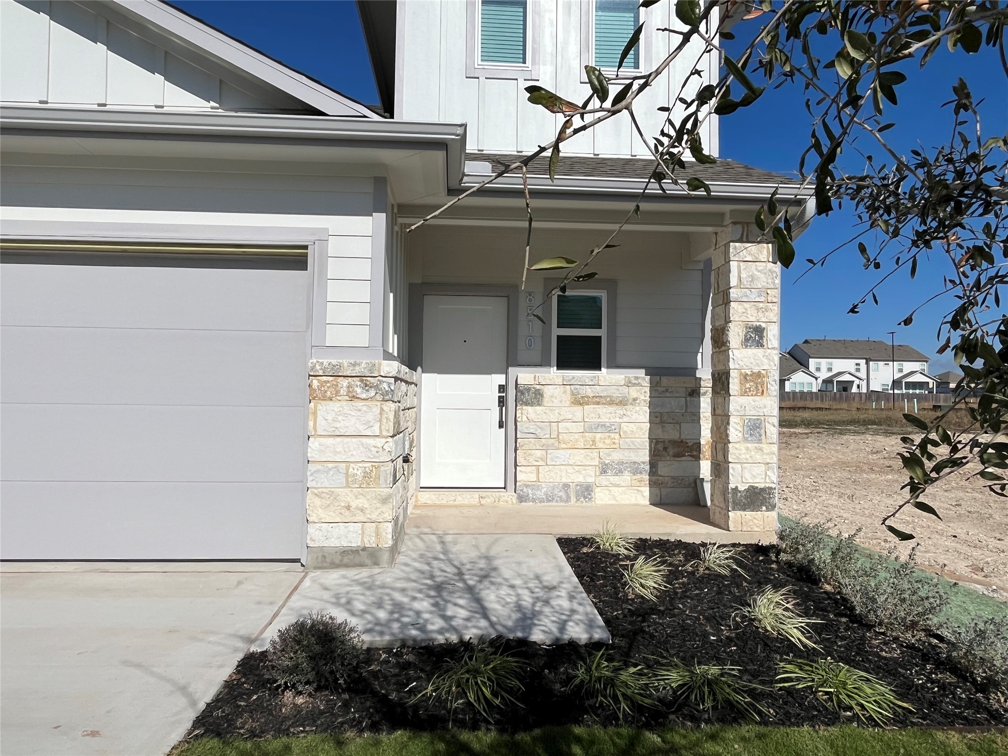 8522 Wellspring Loop Round Rock, TX 78665 - Photo 36 of 37 This is an exterior photo of another home that is the same floorplan/exterior colors and end townhome as 8522 Wellspring Loop