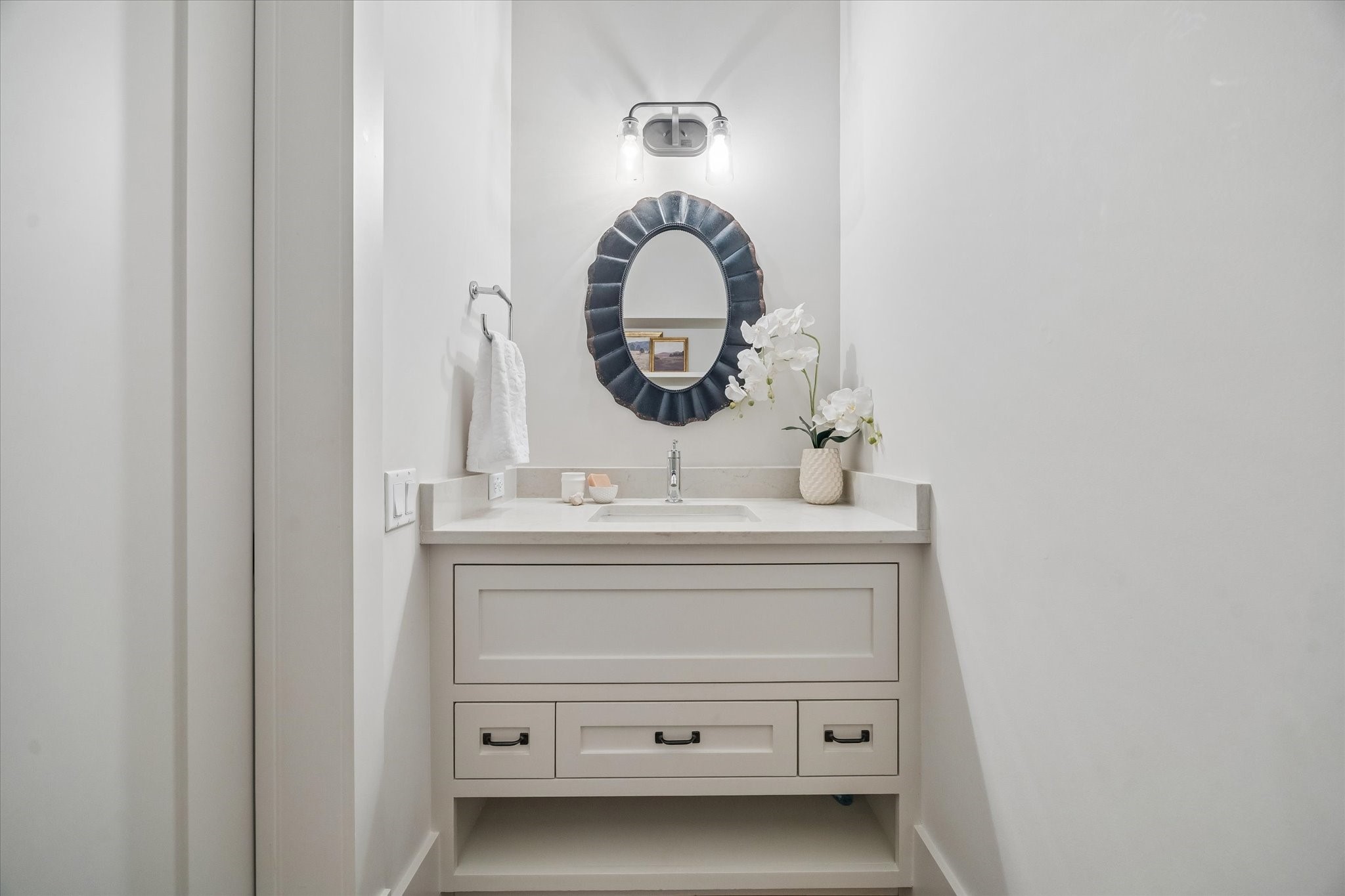 1101 Omar Street Houston, TX 77009 - Photo 17 of 46 Conveniently located between the kitchen, dining, and living spaces, the beautifully appointed powder bath offers both functionality and thoughtful design for everyday living and entertaining.