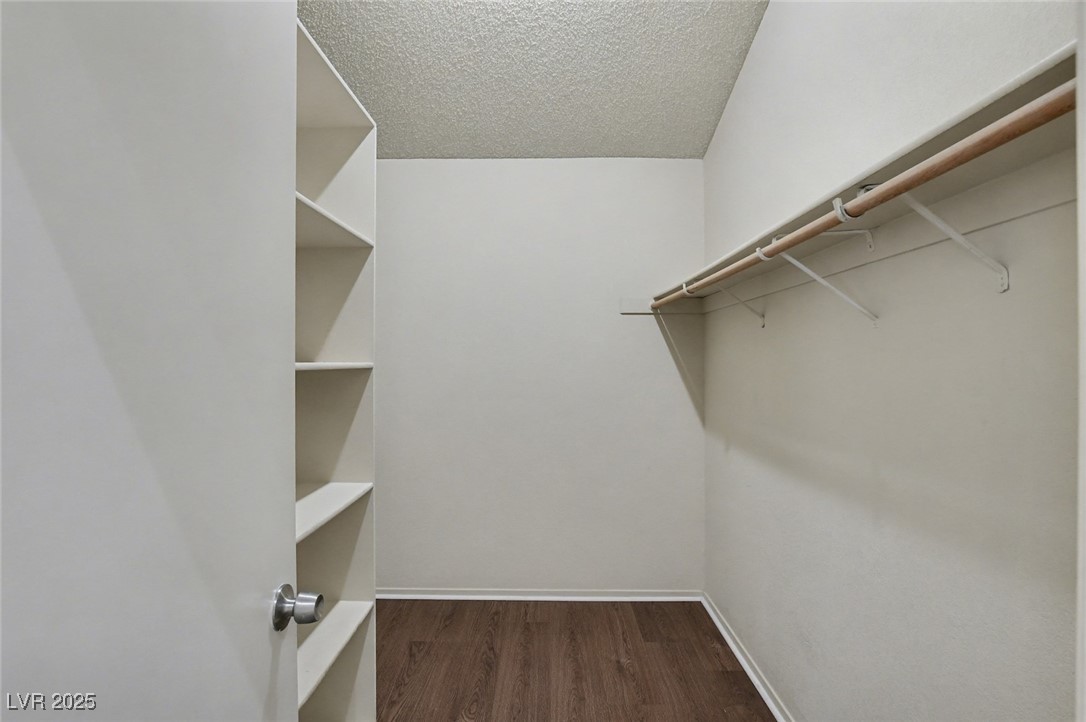 7951 Aspendale Drive Las Vegas, NV 89123 - Photo 24 of 42 Spacious closet featuring dark wood-style floors