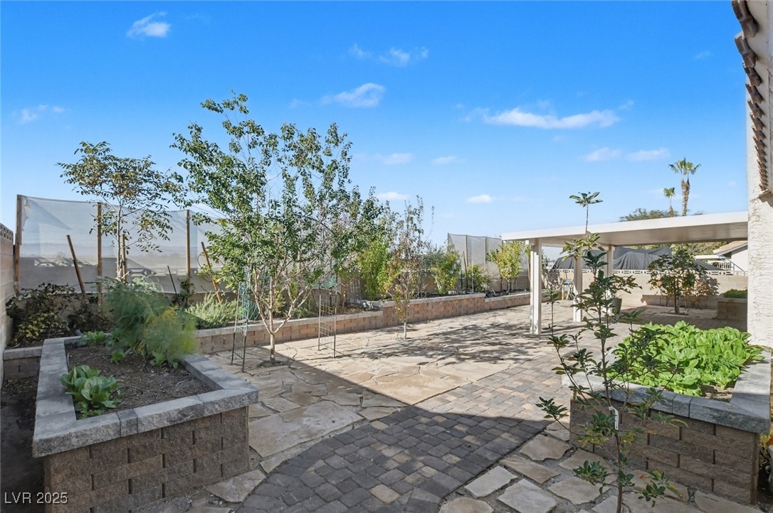 7951 Aspendale Drive Las Vegas, NV 89123 - Photo 38 of 42 Fenced backyard with a patio and a garden
