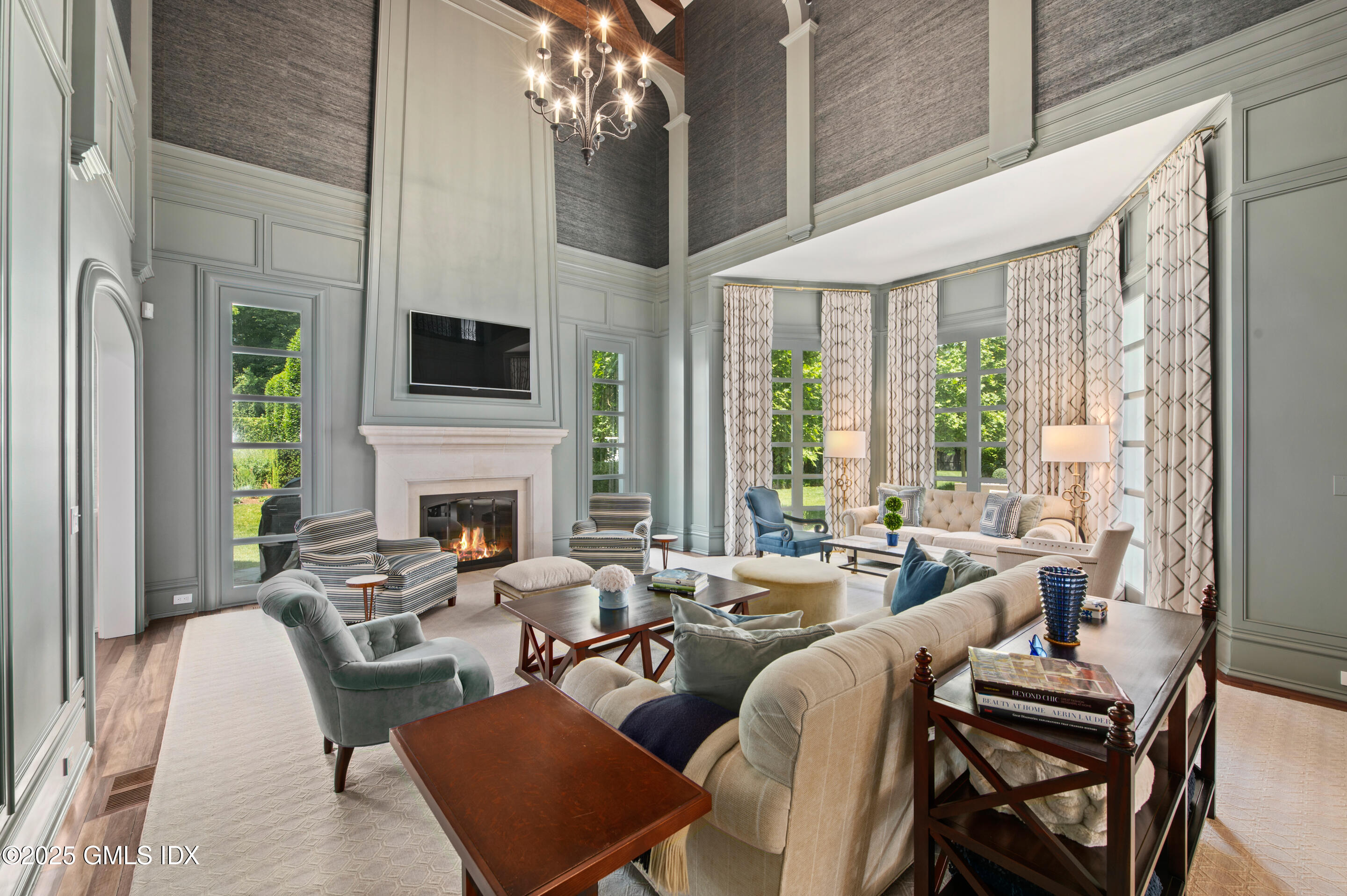 537 North Street Greenwich, CT 06830 - Photo 12 of 27 a living room with furniture a large window and a flat screen tv