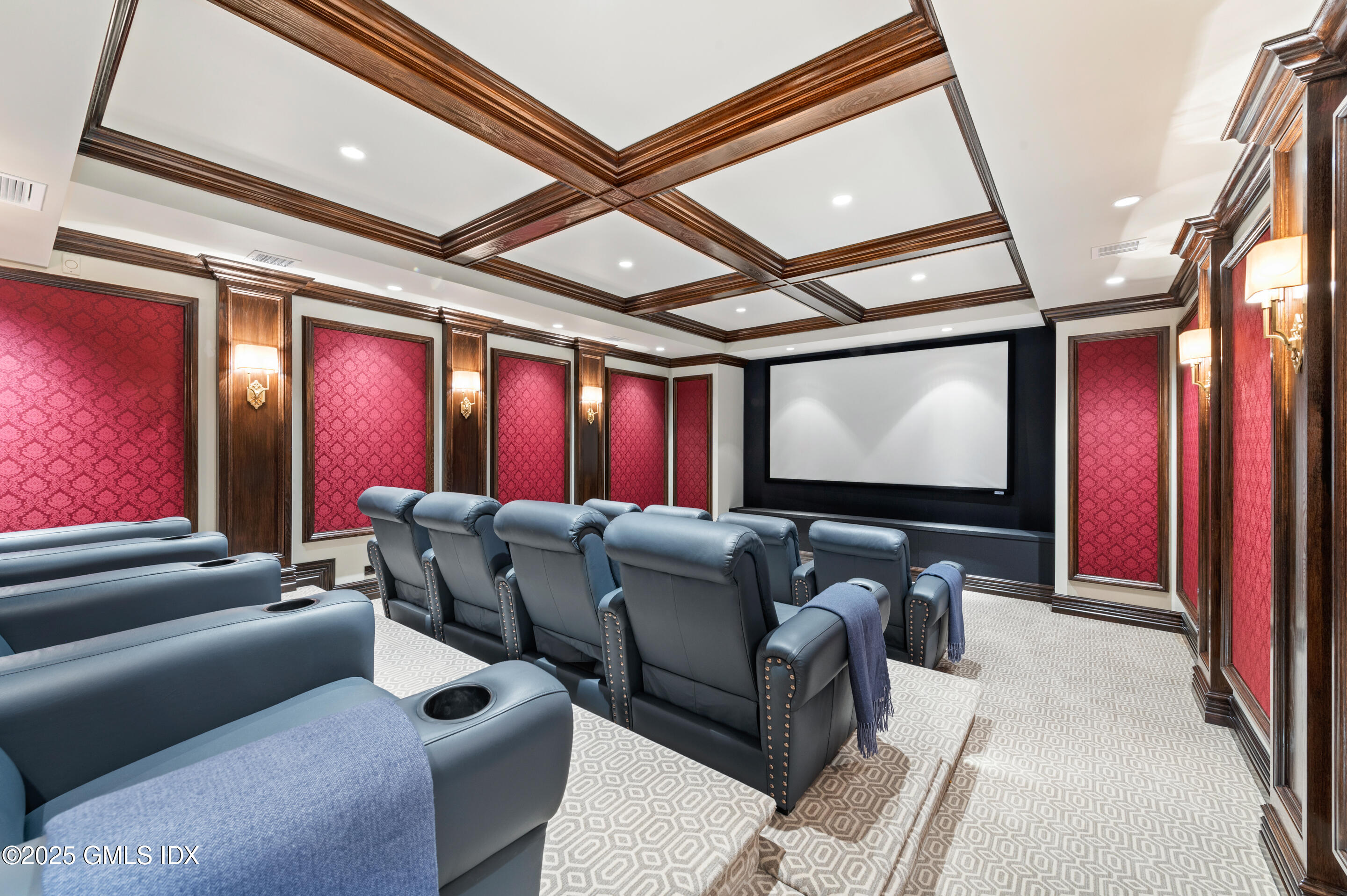 537 North Street Greenwich, CT 06830 - Photo 15 of 27 a media room with lots of chairs and a projector