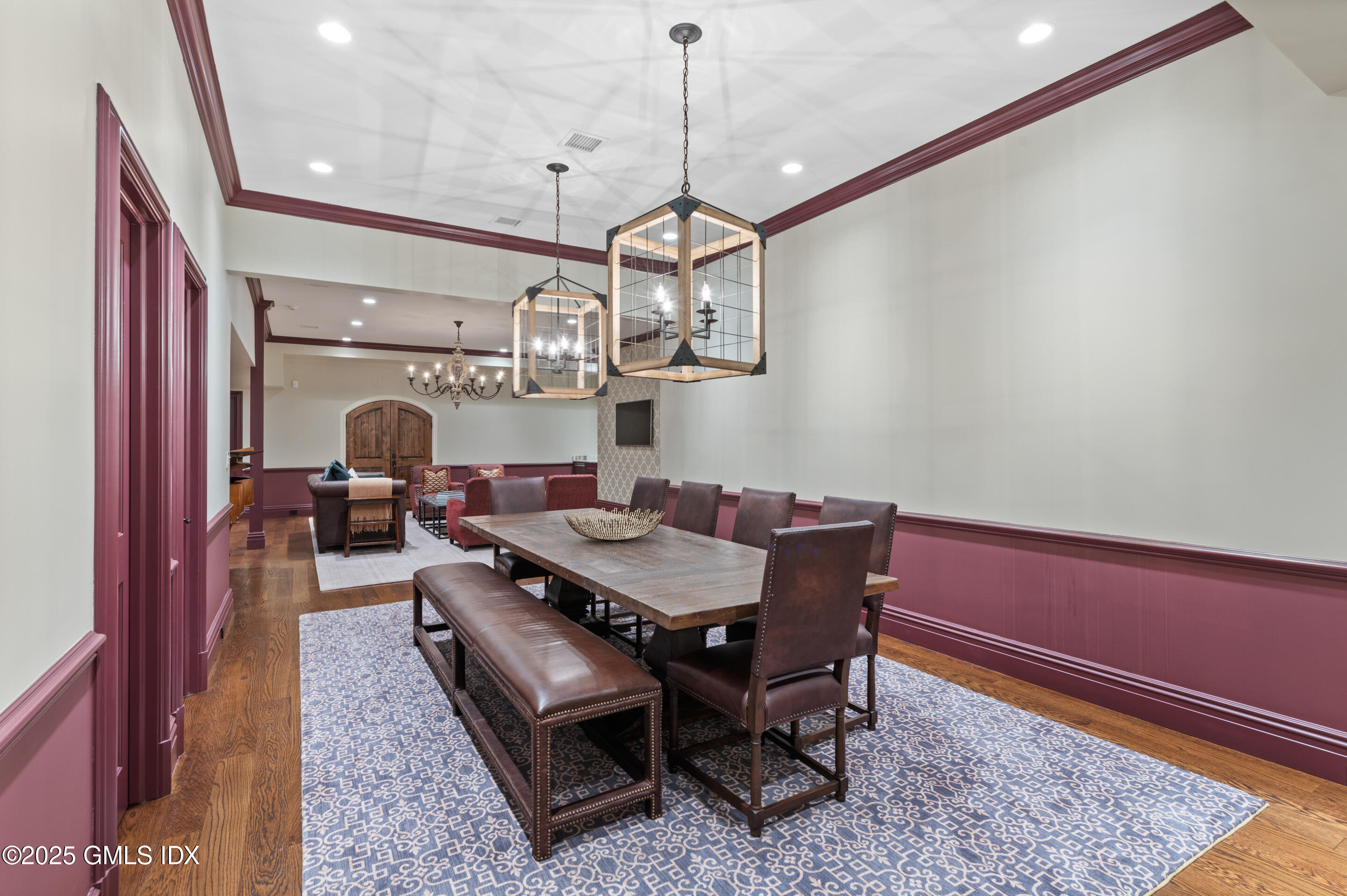 537 North Street Greenwich, CT 06830 - Photo 17 of 27 a view of a dining room with furniture a chandelier and wooden floor