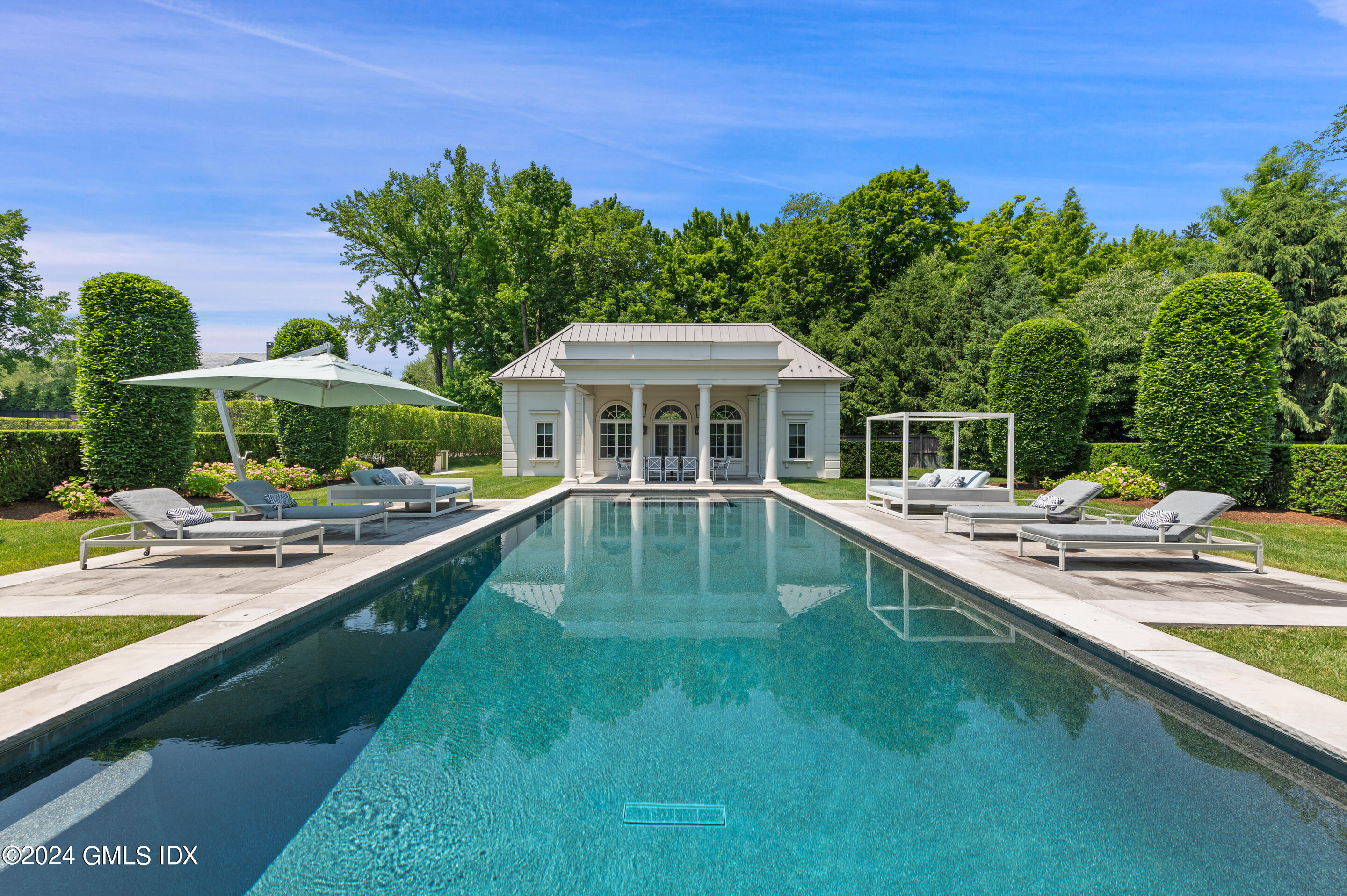 537 North Street Greenwich, CT 06830 - Photo 21 of 27 a view of a house with swimming pool yard and patio