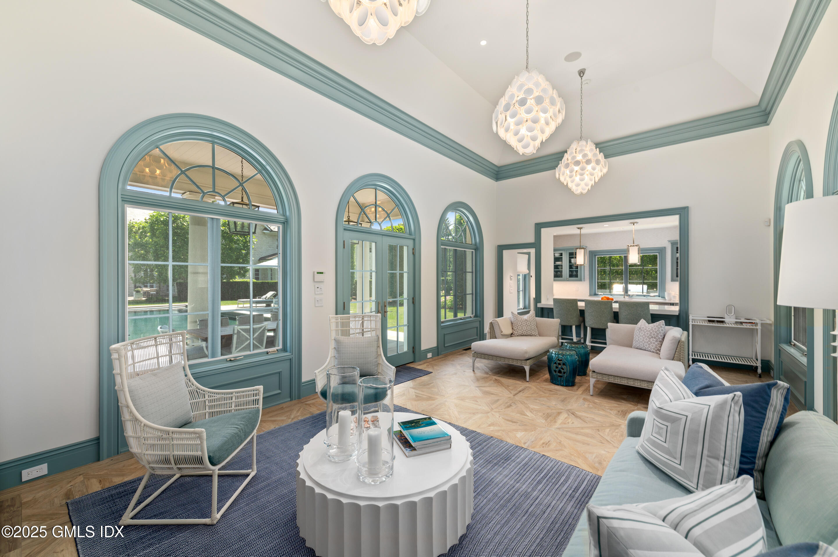 537 North Street Greenwich, CT 06830 - Photo 23 of 27 a living room with furniture chandelier and a large window