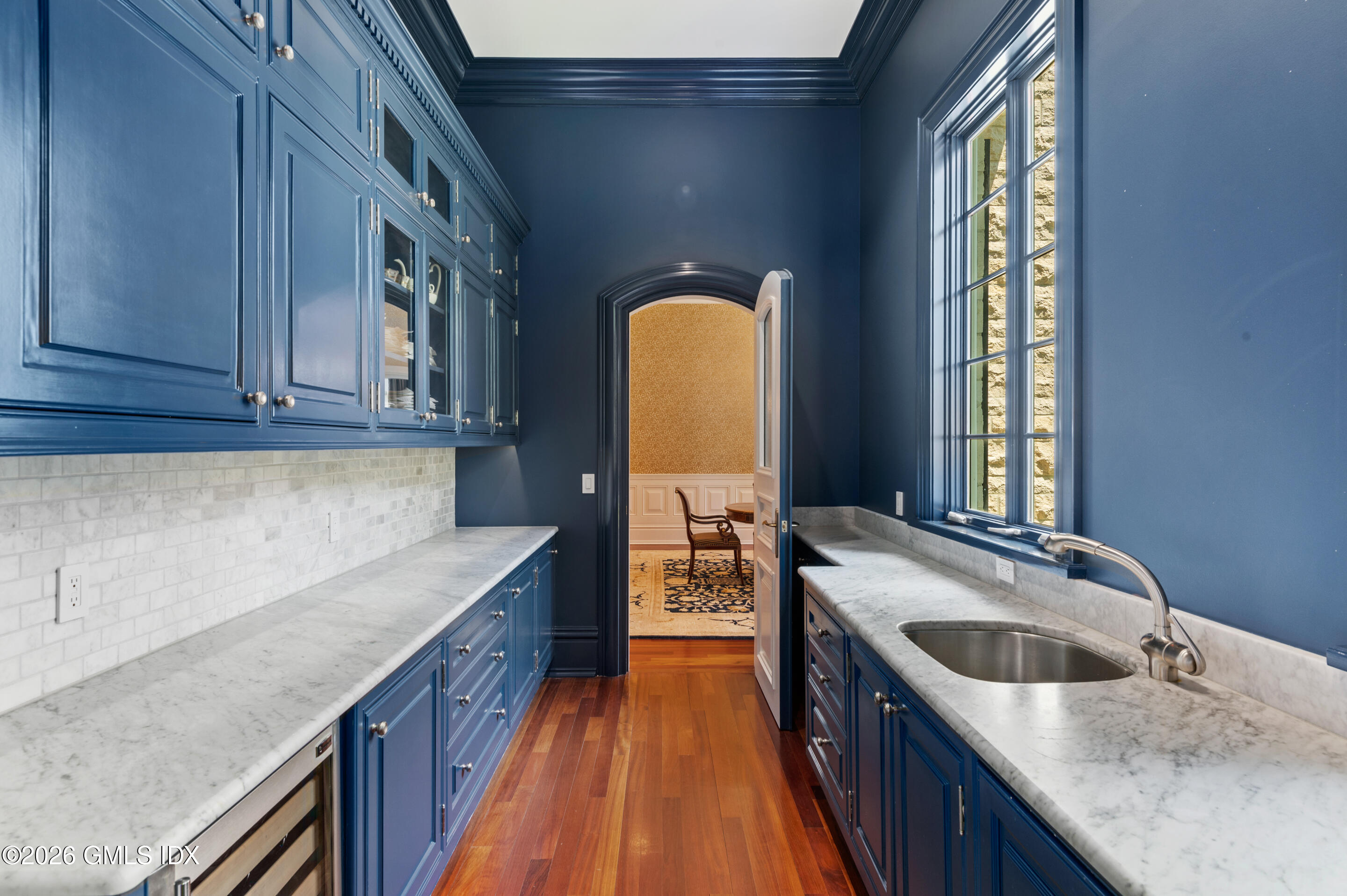 537 North Street Greenwich, CT 06830 - Photo 7 of 27 a kitchen with a sink stove and cabinets