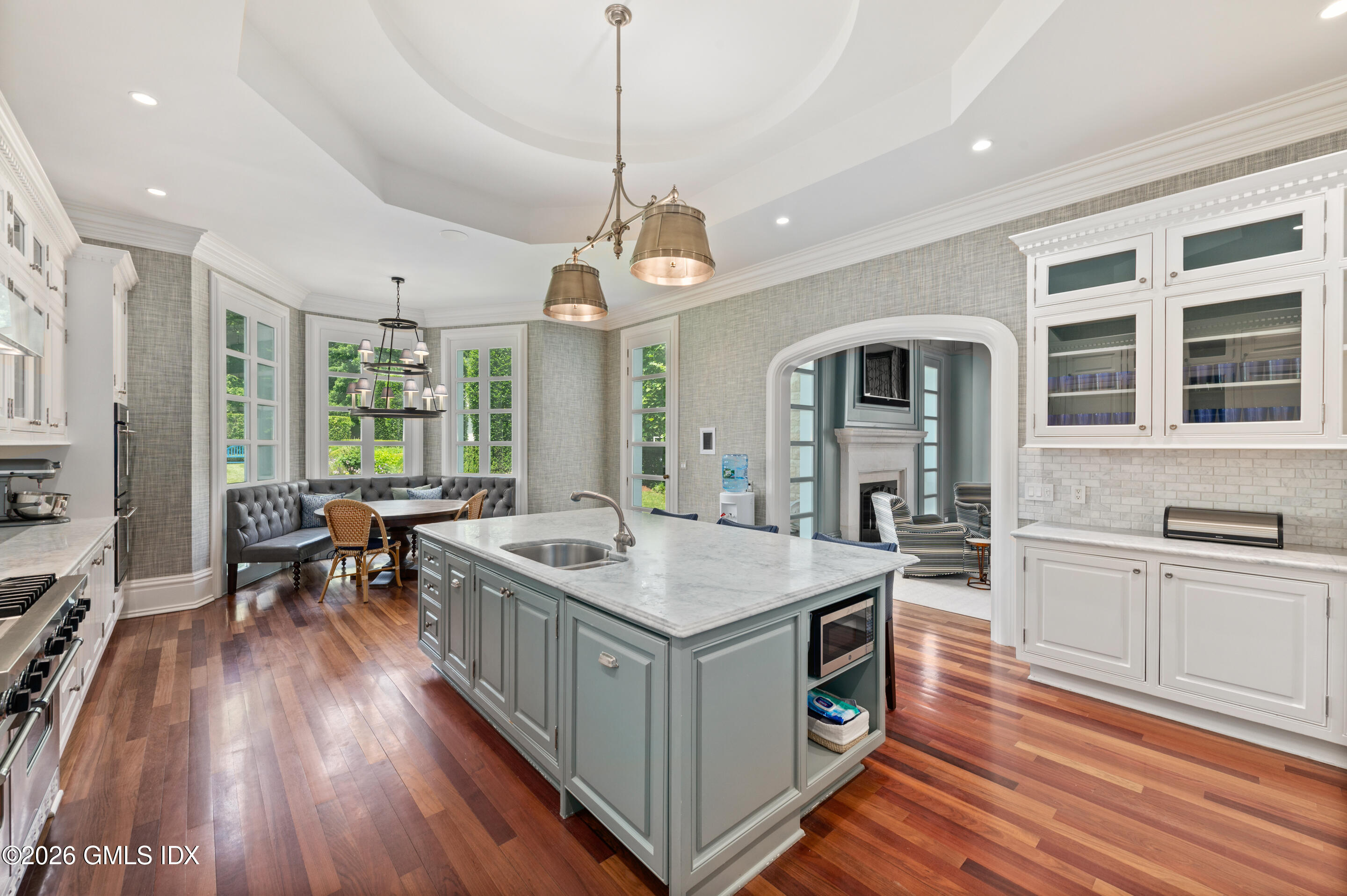 537 North Street Greenwich, CT 06830 - Photo 9 of 27 a kitchen that has a stove a sink and a wooden floor