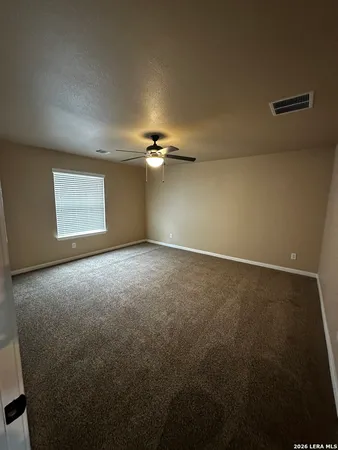 an empty room with a empty space and windows