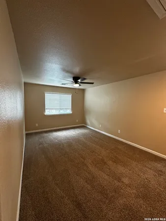 an empty room with a empty space and windows