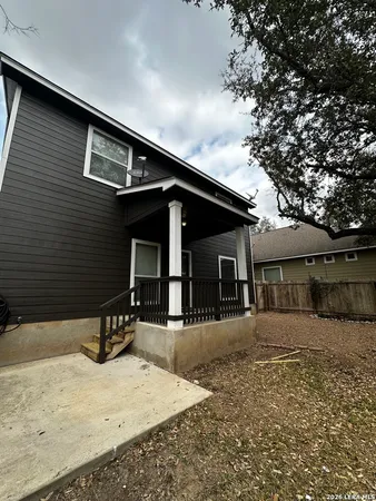 a front view of a house with yard and seating space