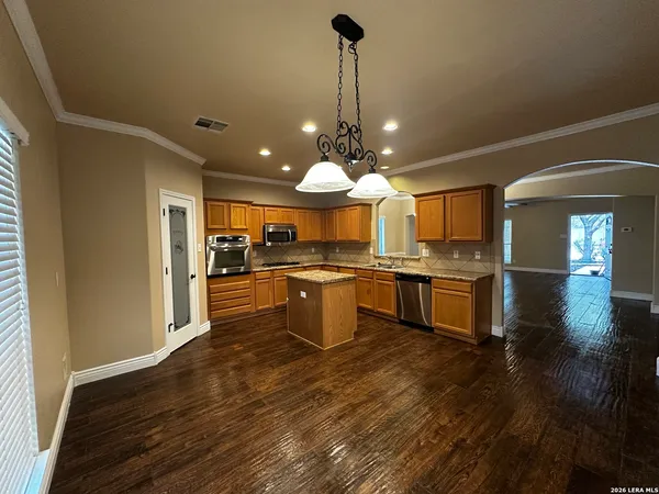 a kitchen with a sink and cabinets