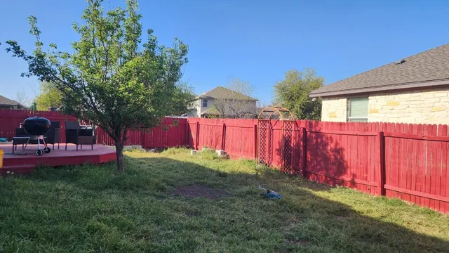 a view of backyard with green space