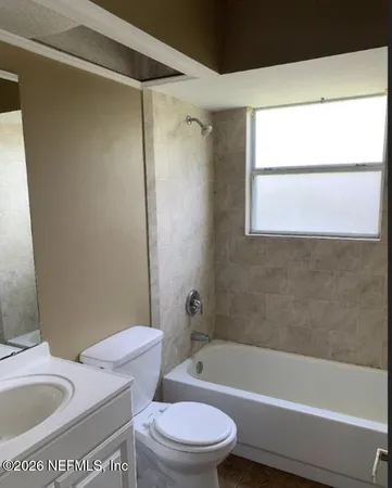 a bathroom with a shower and a bathtub