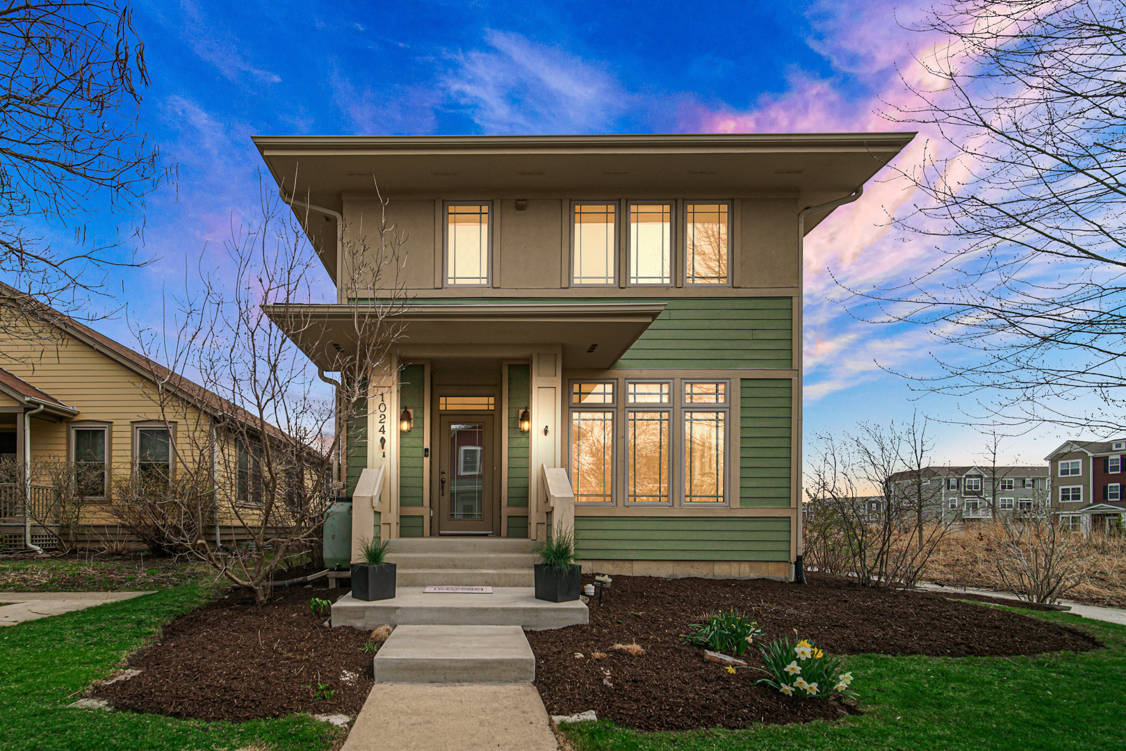 a front view of a house with a yard
