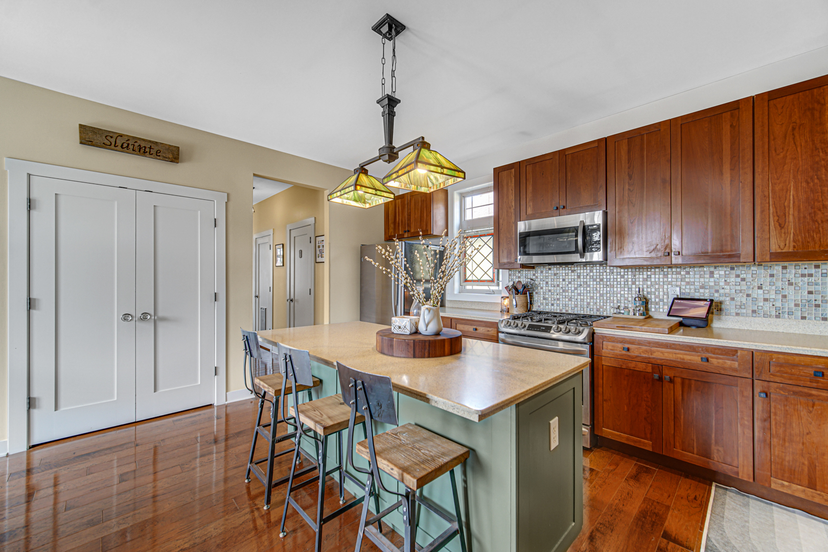 1024 Harris Road Grayslake, IL 60030 - Photo 15 of 68 a kitchen with a table chairs sink and cabinets