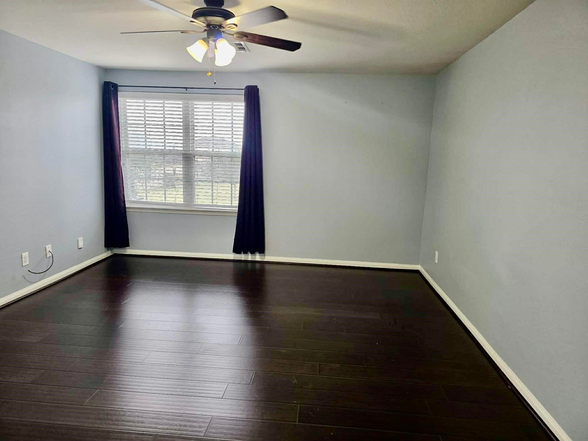 11207 Hall Ridge Court Houston, TX 77075 - Photo 7 of 16 wooden floor in an empty room with a window