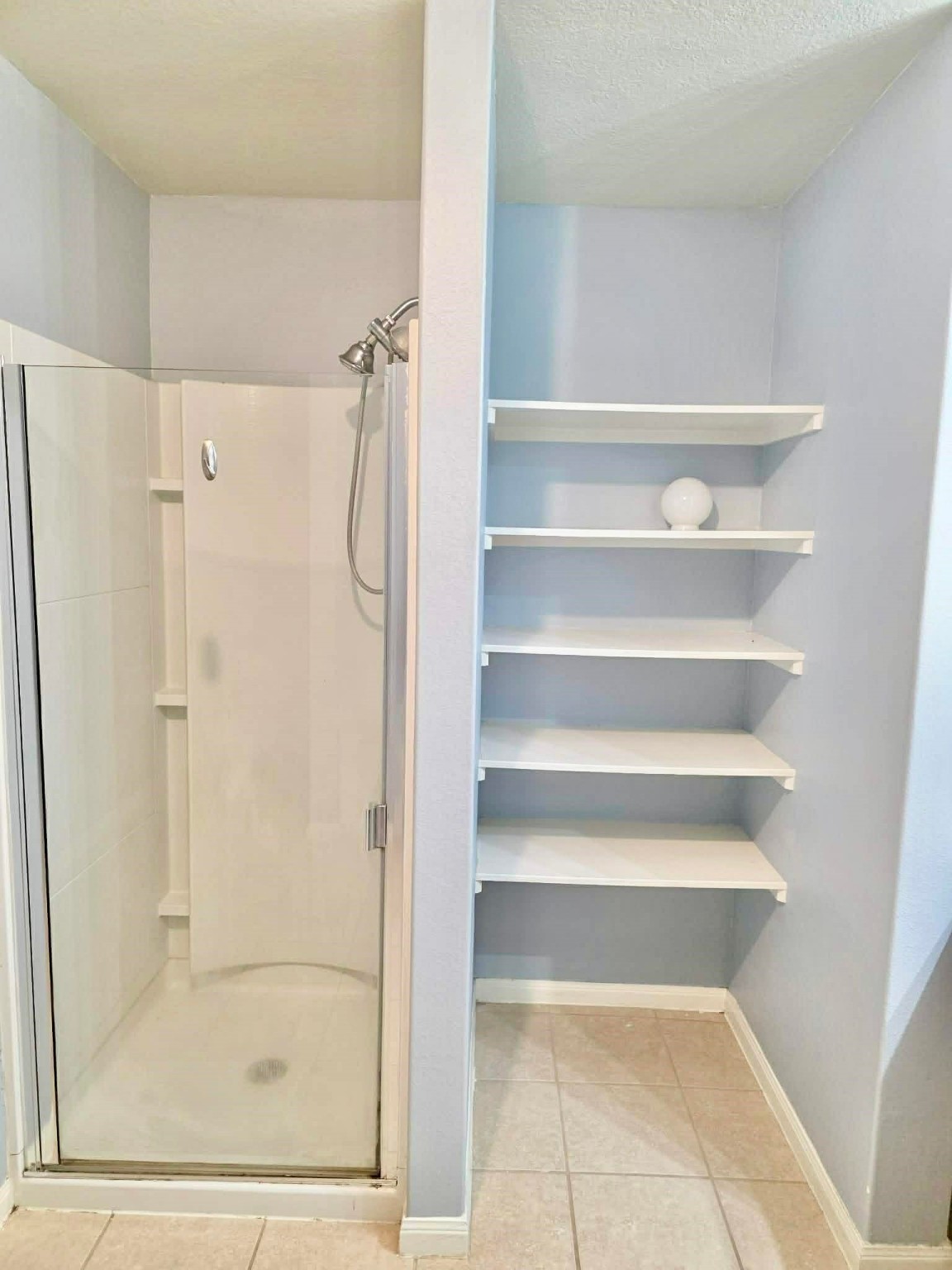 11207 Hall Ridge Court Houston, TX 77075 - Photo 10 of 16 a bathroom with a bathtub and a shower