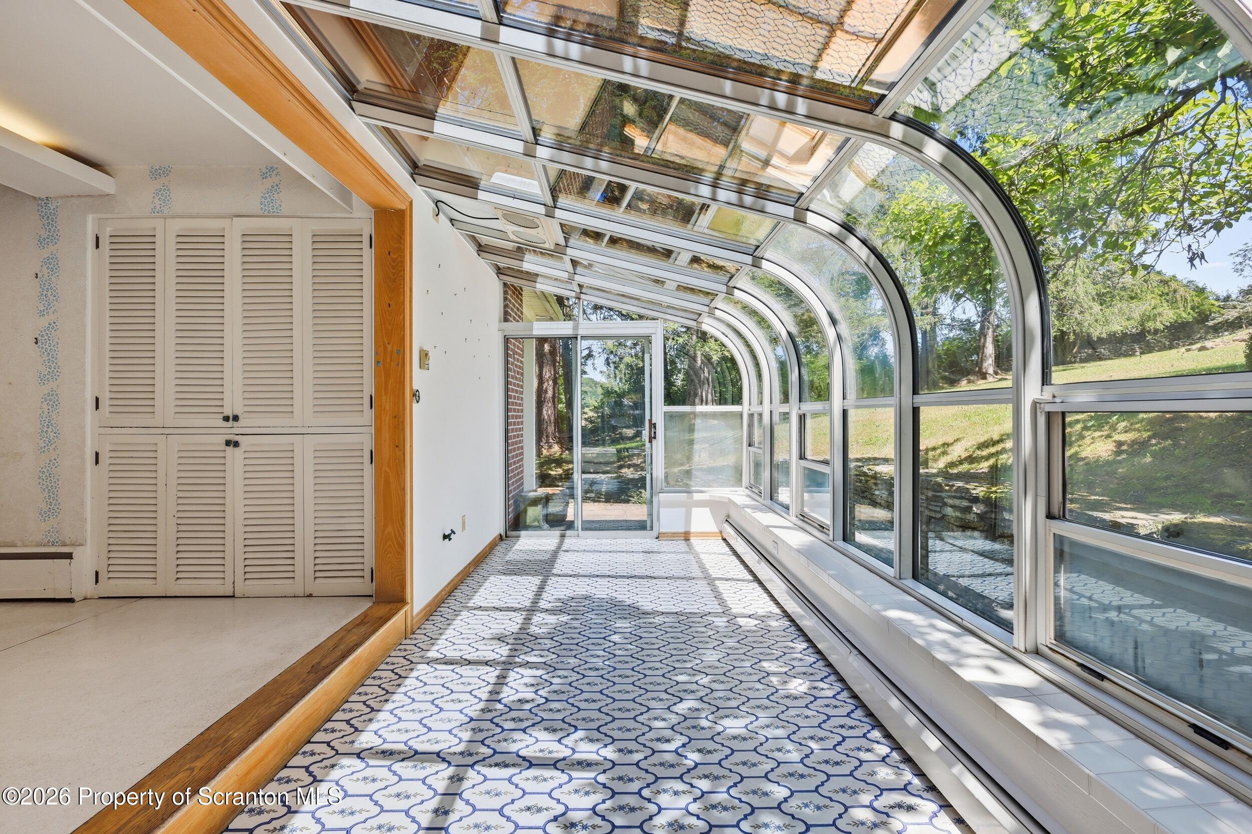 1008 Lily Lake Road Waverly, PA 18471 - Photo 13 of 84 Sun Room