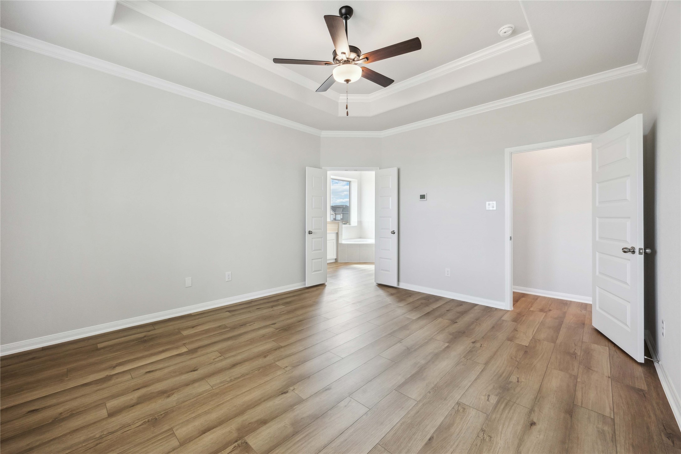 9519 Sweet Tea Lane Needville, TX 77461 - Photo 16 of 35 an empty room with wooden floor and ceiling fan