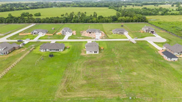 a view of a swimming pool with a yard