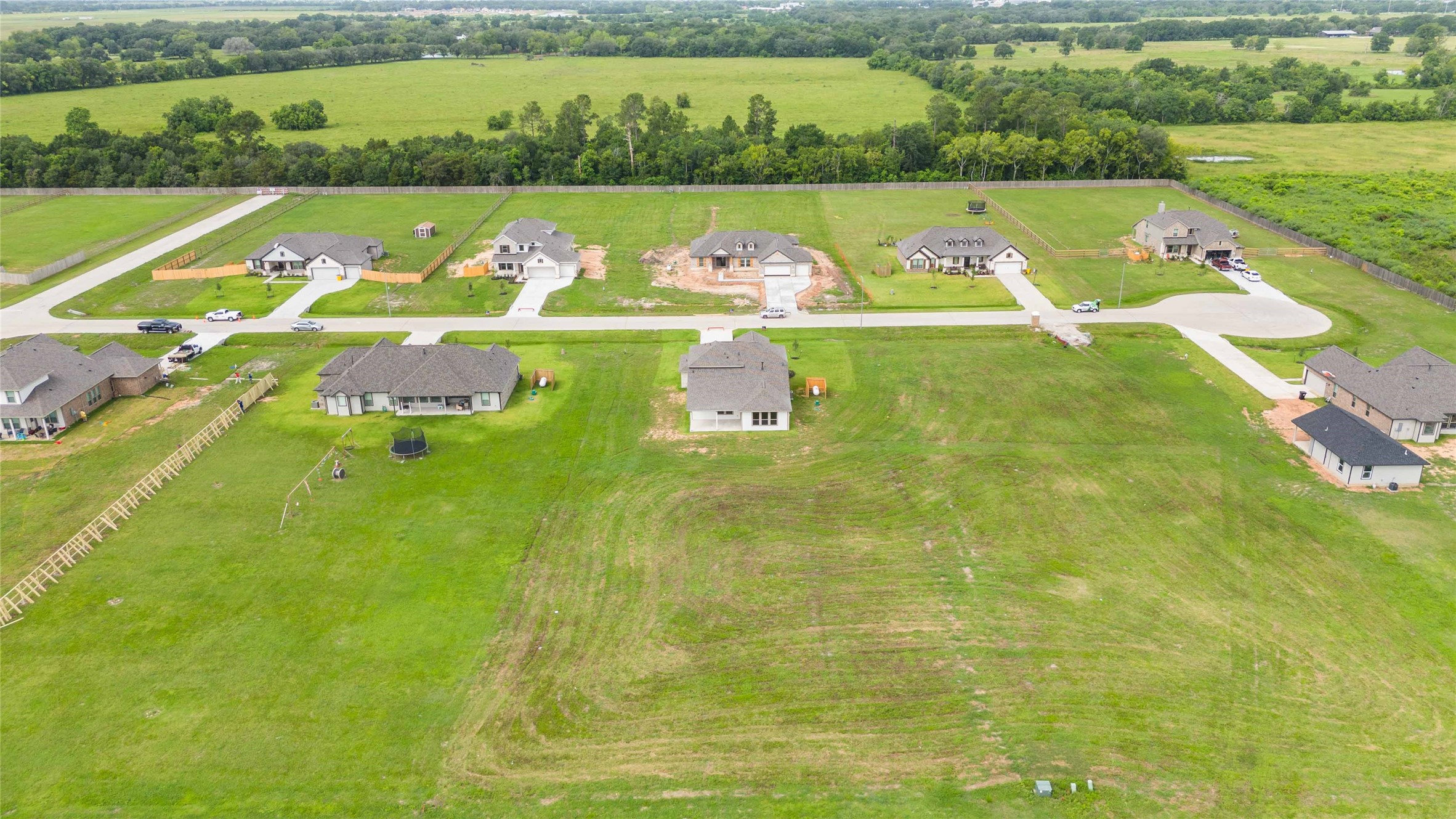 9519 Sweet Tea Lane Needville, TX 77461 - Photo 32 of 35 a view of a swimming pool with a yard