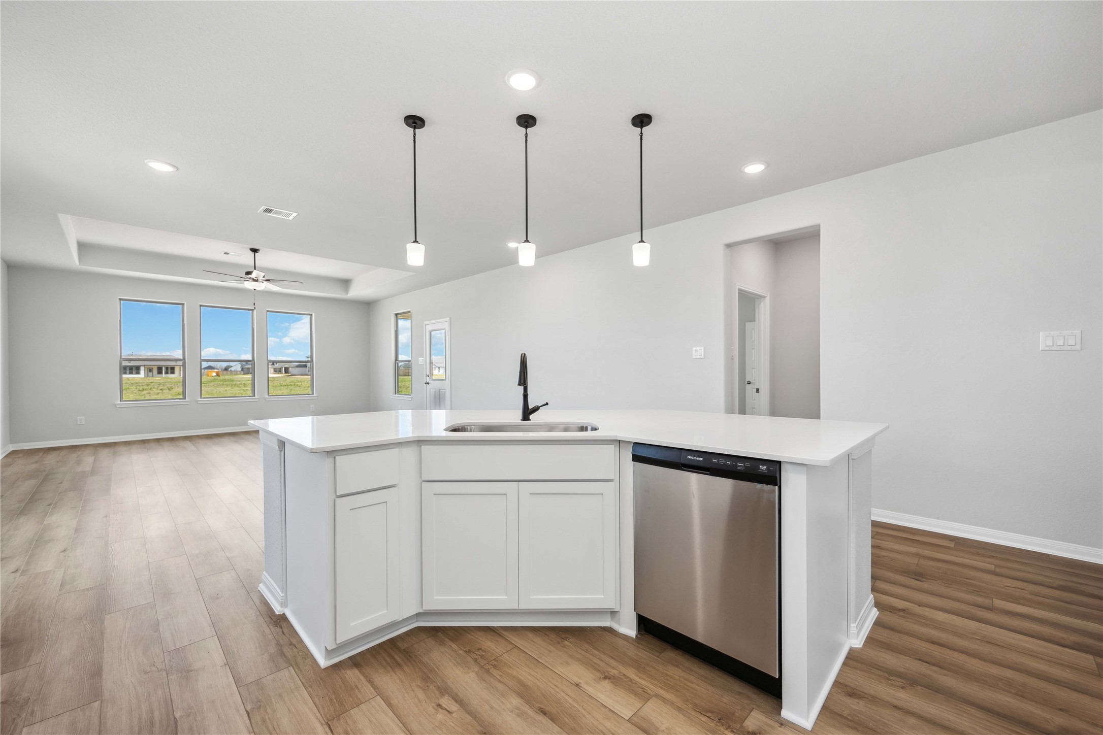 9519 Sweet Tea Lane Needville, TX 77461 - Photo 6 of 35 a kitchen with a sink and cabinets