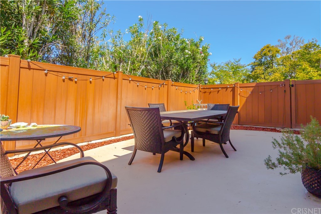 27462 Country Glen Road Agoura Hills, CA 91301 - Photo 16 of 19 a patio with table and chairs