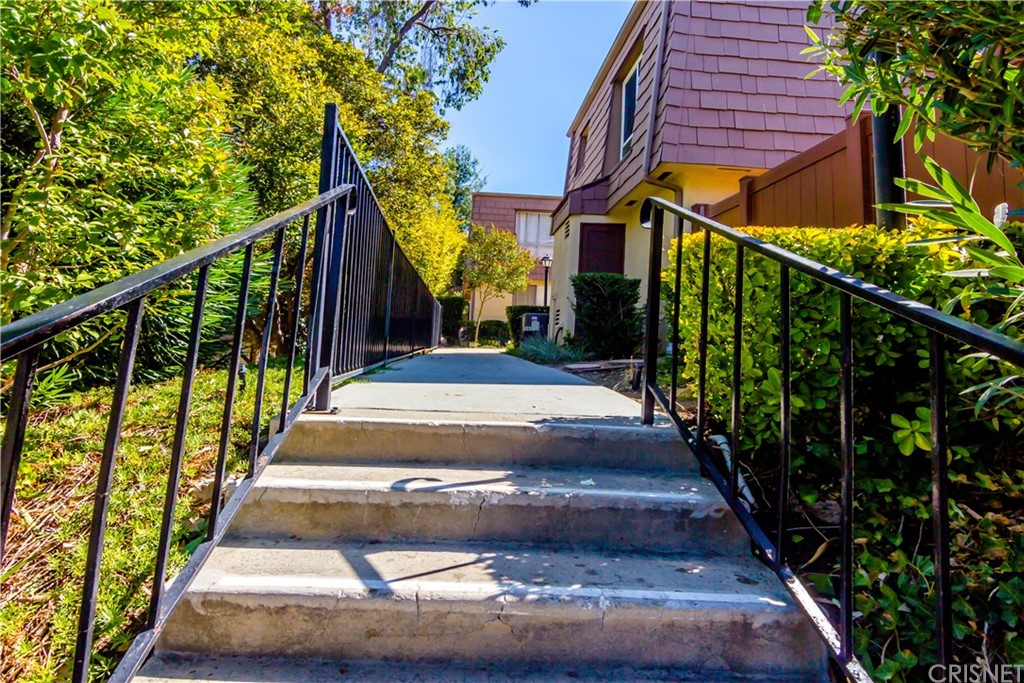 27462 Country Glen Road Agoura Hills, CA 91301 - Photo 17 of 19 a view of a pathway of a house with wooden stairs