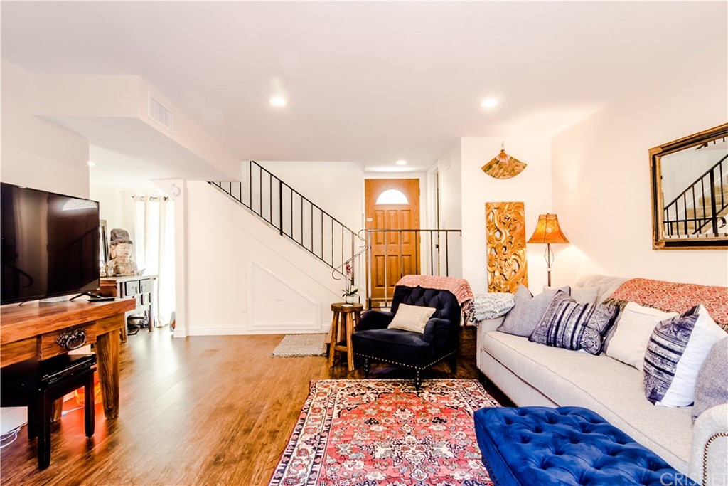 27462 Country Glen Road Agoura Hills, CA 91301 - Photo 3 of 19 a living room with furniture and a flat screen tv
