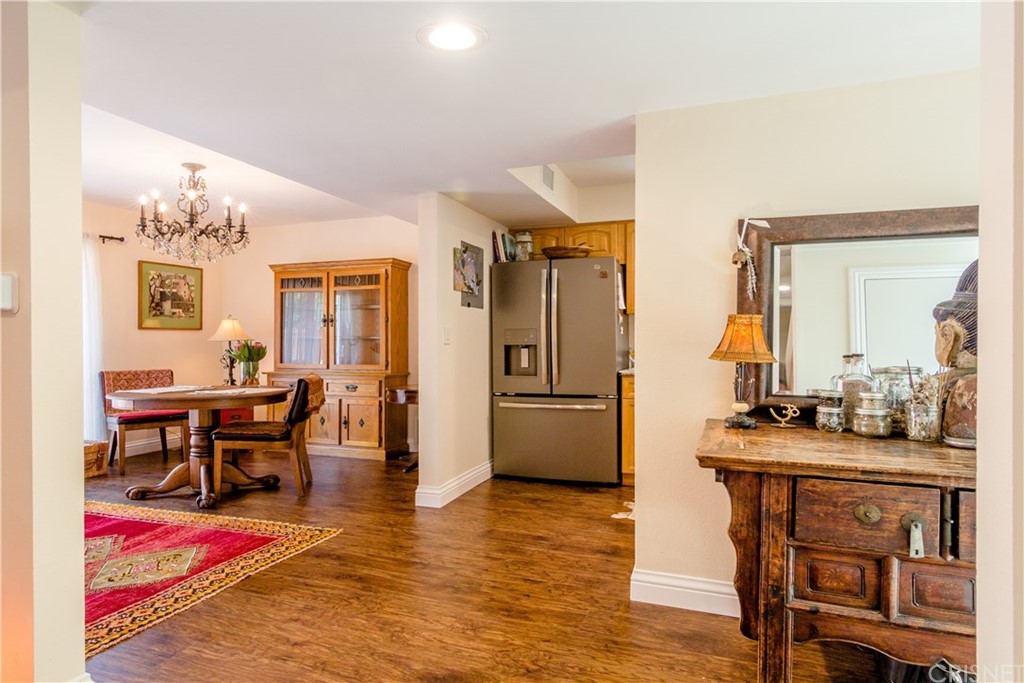 27462 Country Glen Road Agoura Hills, CA 91301 - Photo 5 of 19 a view of a dining room with furniture and wooden floor