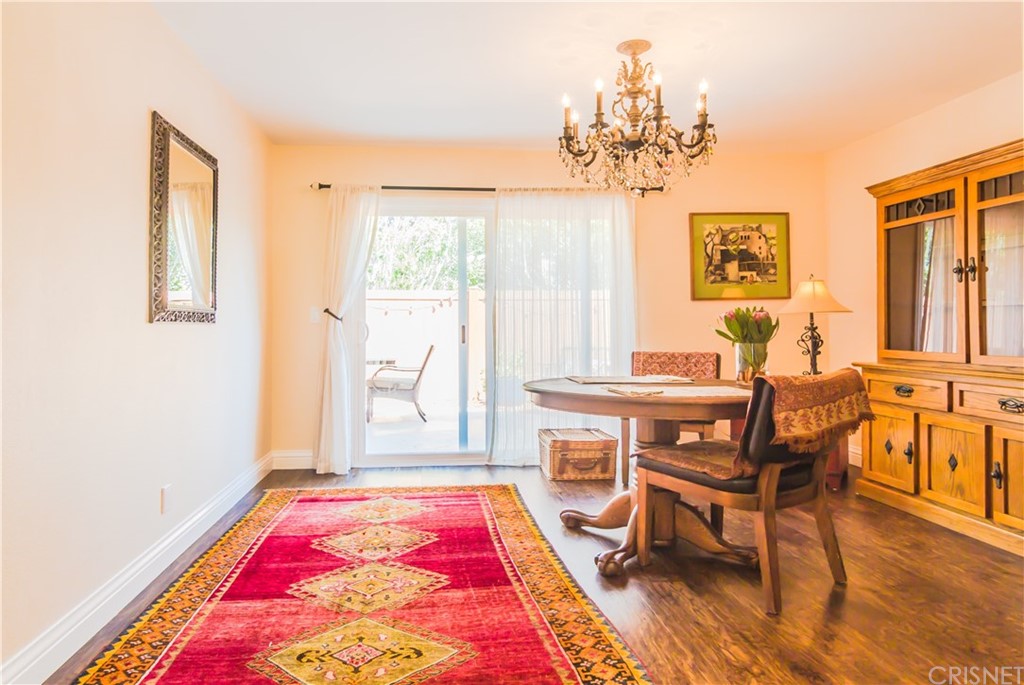 27462 Country Glen Road Agoura Hills, CA 91301 - Photo 6 of 19 a view of a dining room with furniture and a chandelier