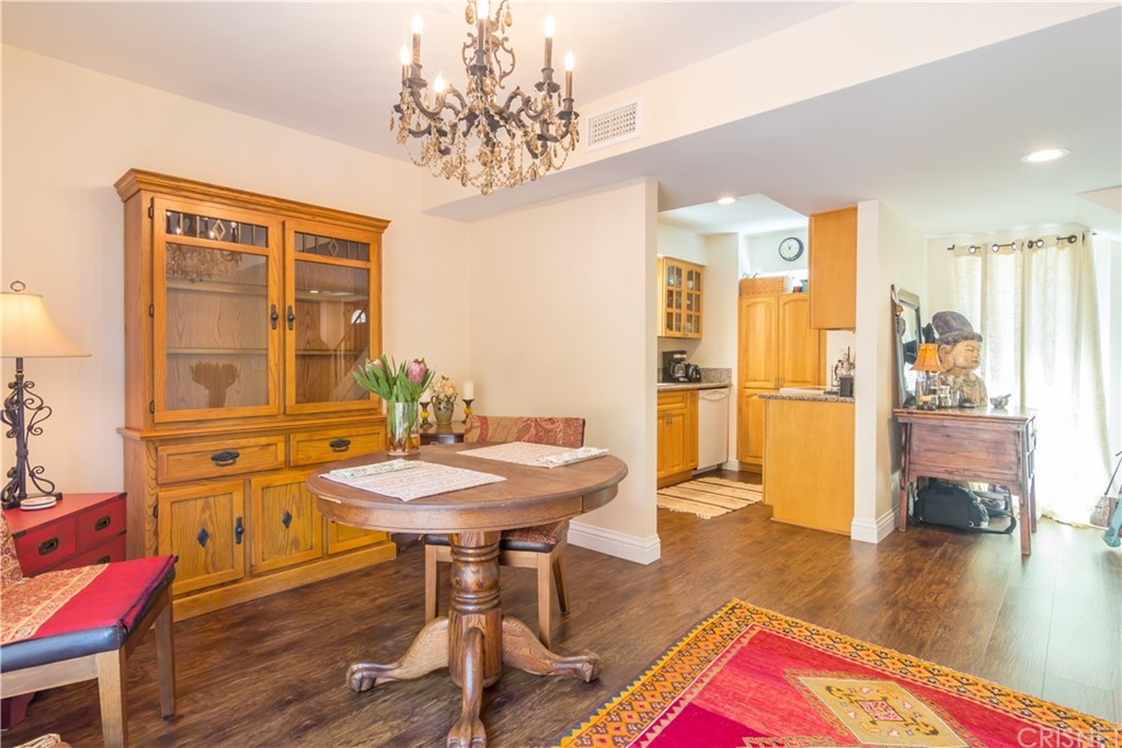 27462 Country Glen Road Agoura Hills, CA 91301 - Photo 7 of 19 a view of a dining room with furniture and wooden floor