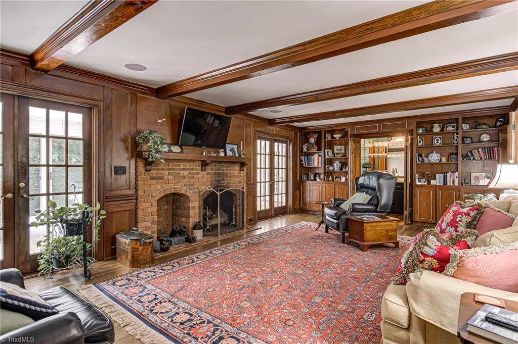 618 Hertford Road Winston-Salem, NC 27104 - Photo 11 of 42 Den with gas logs, sunroom is adjacent to den.